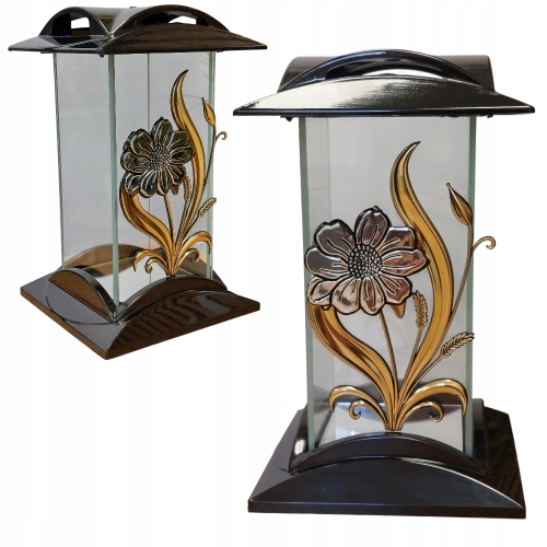 szklany znicz prostokąt z aplikacją srebrno - złotego kwiatka. podstawa oraz pokrywa czarne