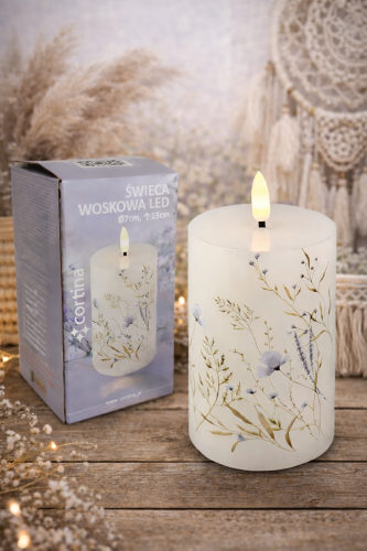 Świeca woskowa  LED biała w kwiaty niebieskie na baterie wysokość 13 cm średnica  7 cm
